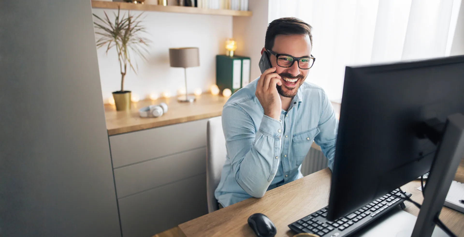 A relaxed remote professional taking a break at their desk